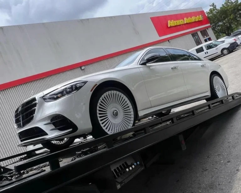 Denver towing service picking up white car